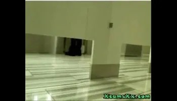 Busty blonde gets filthy in public restroom on cam